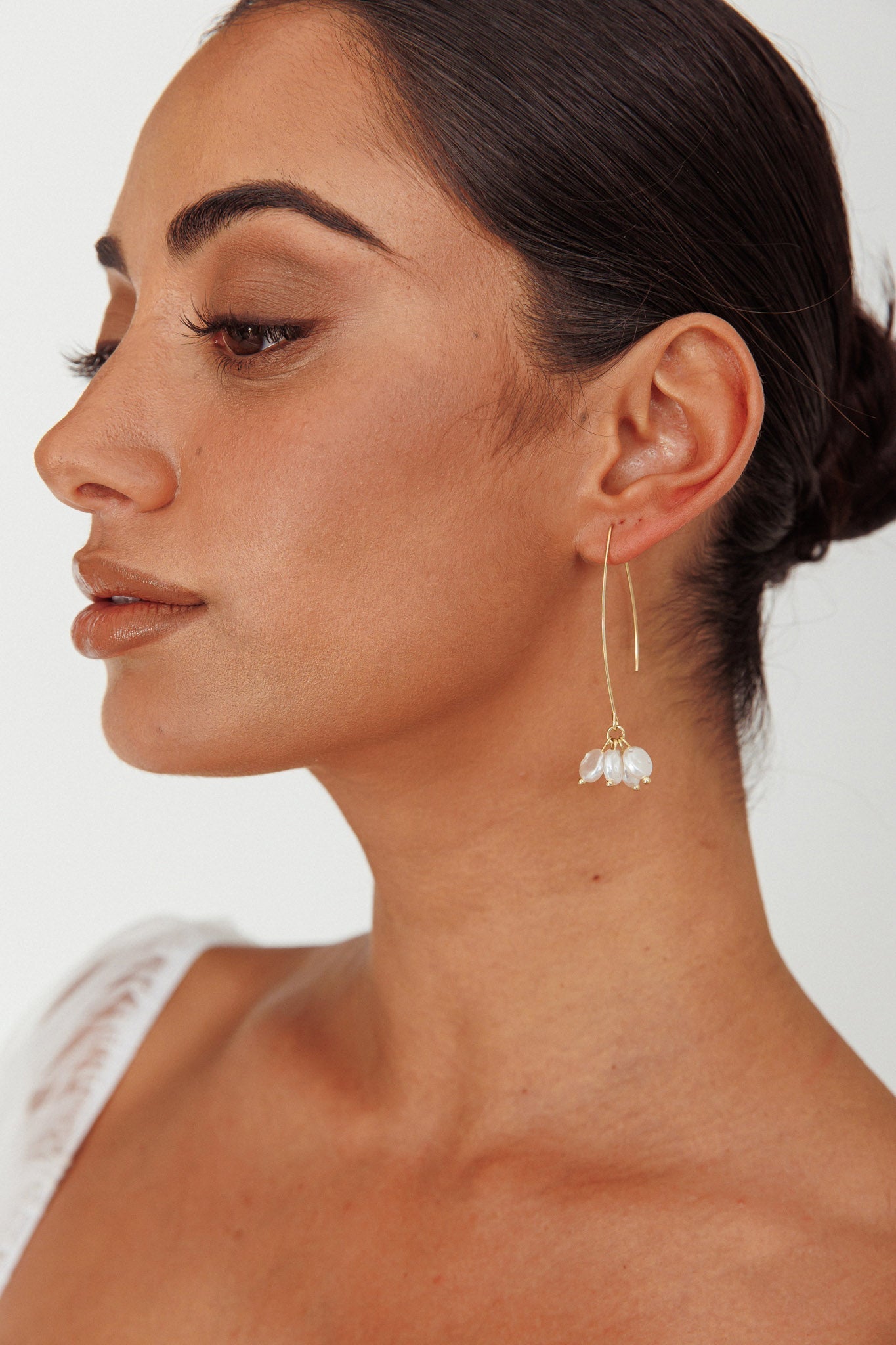 Long Hook Earrings with Golden Pearl Accents